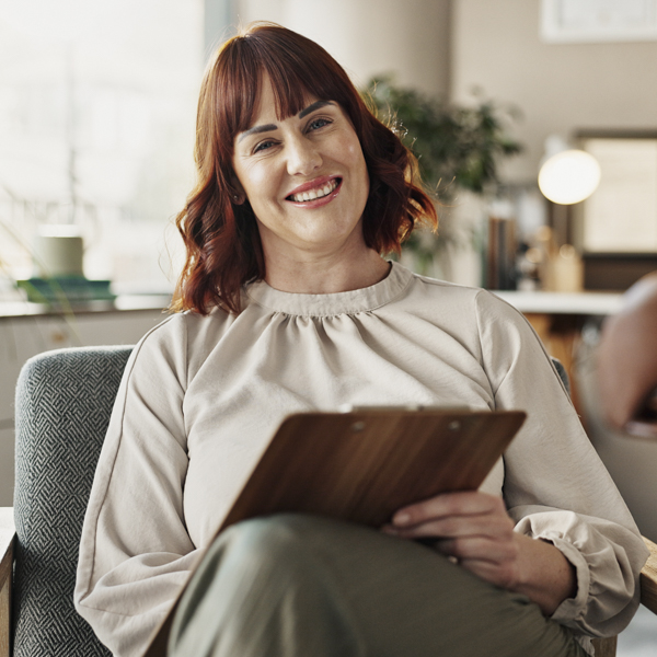 Happy therapist woman portrait and checklist for counselling, help and clipboard for support in office. Promoting marketing for therapists.